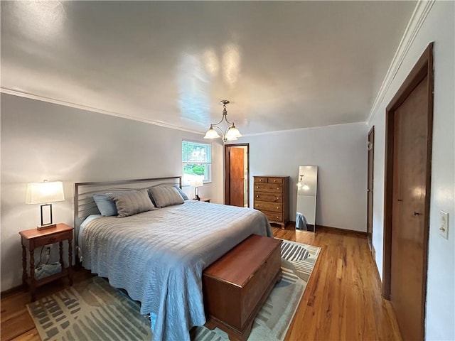 116 Thornberry Dr, Churchill Boro, PA 15235 - bedroom with crown molding, light wood-style flooring, and a chandelier
