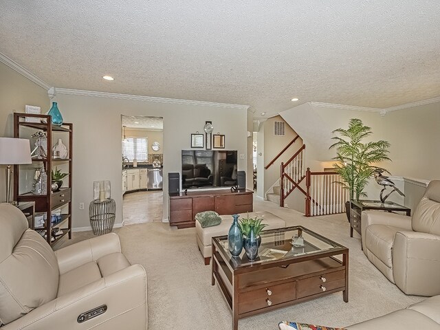 living room featuring crown molding, recessed lighting, a textured ceiling, and light colored carpet
