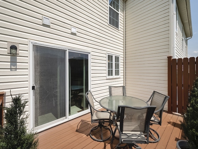 wooden deck featuring outdoor dining area