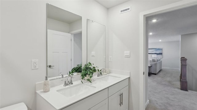 410 Barons Ct, Peters Twp, PA 15367 - bathroom featuring double vanity, toilet, baseboards, and recessed lighting