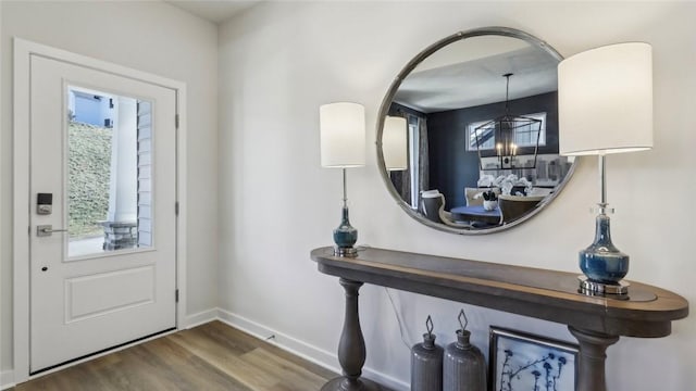 410 Barons Ct, Peters Twp, PA 15367 - foyer entrance featuring wood finished floors, baseboards, and a chandelier