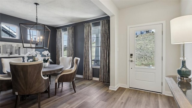 410 Barons Ct, Peters Twp, PA 15367 - dining area featuring a chandelier, wood finished floors, and baseboards