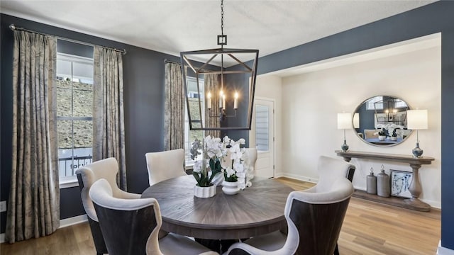 410 Barons Ct, Peters Twp, PA 15367 - dining room featuring a chandelier, wood finished floors, and baseboards