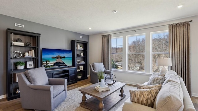 410 Barons Ct, Peters Twp, PA 15367 - living room featuring wood finished floors, baseboards, and recessed lighting