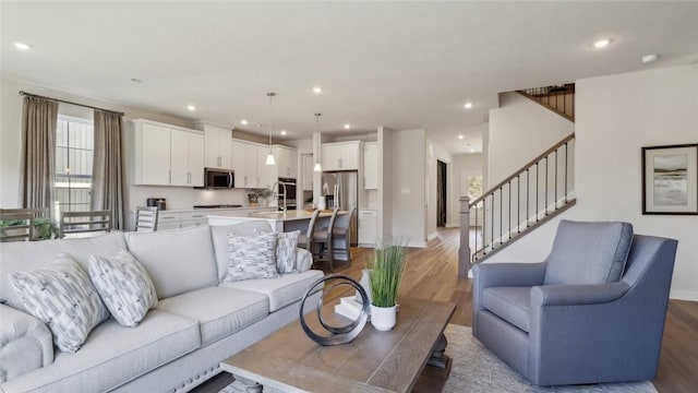 410 Barons Ct, Peters Twp, PA 15367 - living room with light wood-type flooring, stairway, recessed lighting, and baseboards