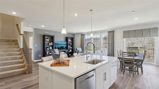 410 Barons Ct, Peters Twp, PA 15367 - kitchen featuring a sink, stainless steel dishwasher, light wood-style flooring, a center island with sink, and recessed lighting