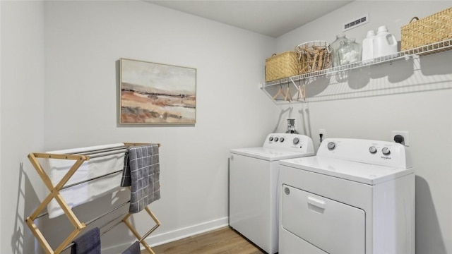 410 Barons Ct, Peters Twp, PA 15367 - laundry area featuring washer and dryer, light wood finished floors, and baseboards