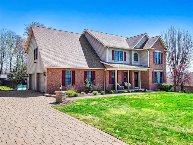 1312 Red Cut Lodge Rd, Derry Twp, PA 15650 - traditional-style house with covered porch, an attached garage, fence, and a front lawn