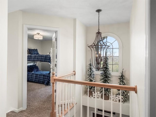 1312 Red Cut Lodge Rd, Derry Twp, PA 15650 - hall with carpet flooring and a notable chandelier