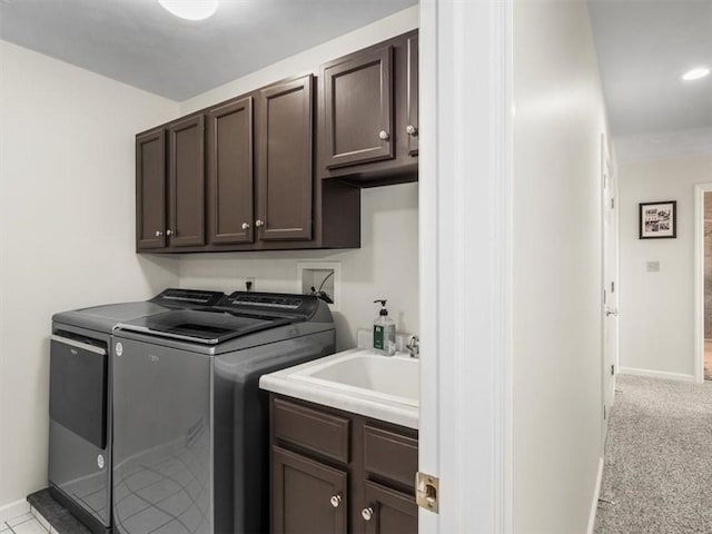 1312 Red Cut Lodge Rd, Derry Twp, PA 15650 - washroom with washing machine and dryer, baseboards, light colored carpet, a sink, and cabinet space