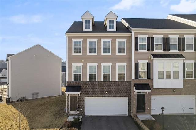 106 Sweetwater Dr, Moon/Crescent Twp, PA 15108 - view of property featuring brick siding, an attached garage, and aphalt driveway