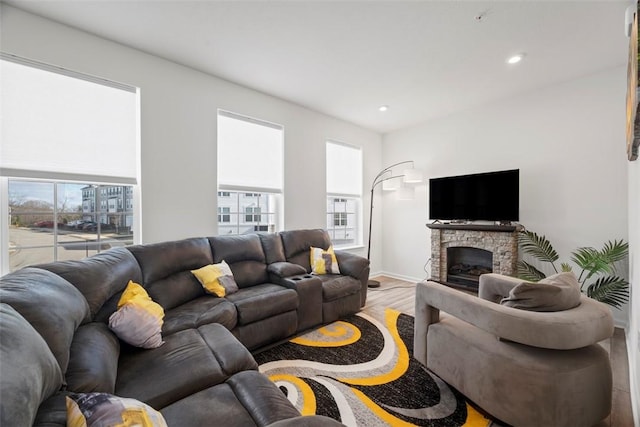106 Sweetwater Dr, Moon/Crescent Twp, PA 15108 - living room with recessed lighting, baseboards, a stone fireplace, and wood finished floors