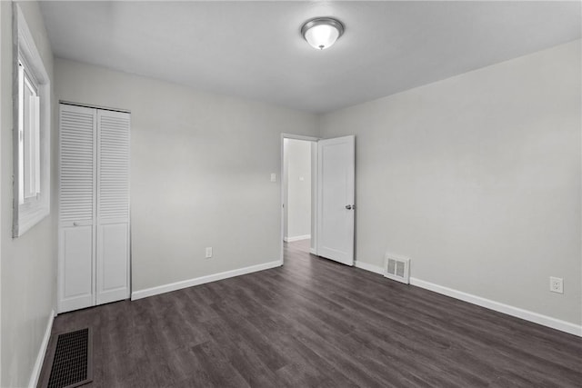 113 Bryant Dr, Penn Hills, PA 15235 - unfurnished bedroom featuring dark wood-style flooring, baseboards, and visible vents