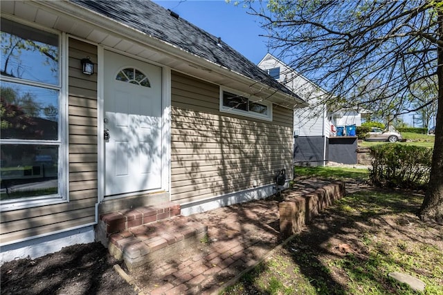 113 Bryant Dr, Penn Hills, PA 15235 - view of side of property featuring roof with shingles and entry steps