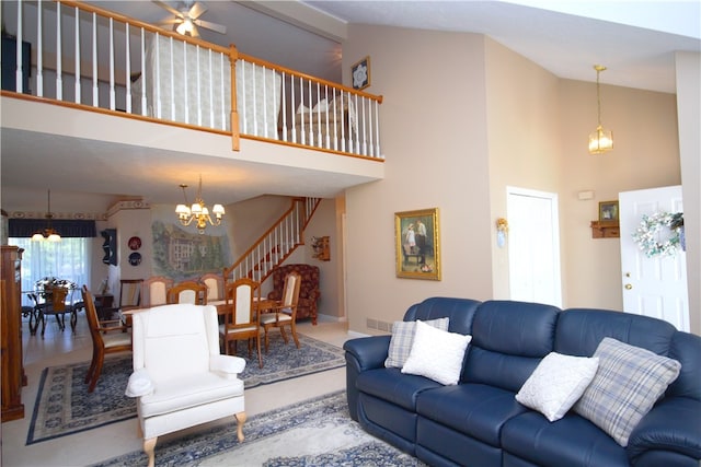 living area featuring a notable chandelier, high vaulted ceiling, and stairway