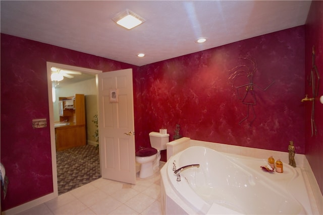 bathroom featuring toilet, tile patterned floors, recessed lighting, baseboards, and a garden tub