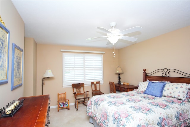 bedroom featuring baseboards, a ceiling fan, and carpet flooring