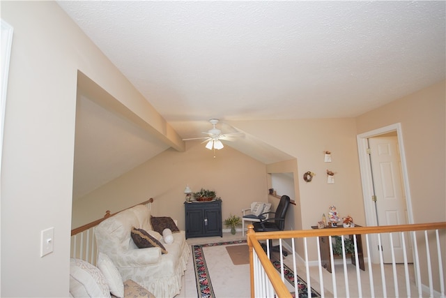 living area with carpet flooring, ceiling fan, and lofted ceiling