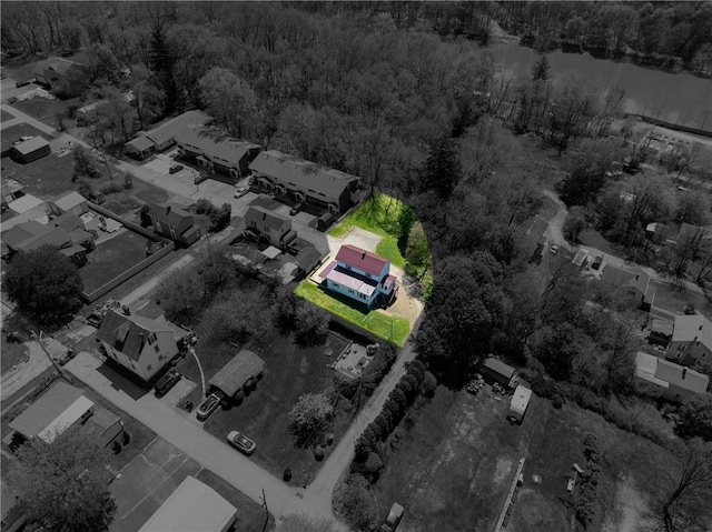 drone / aerial view featuring a wooded view