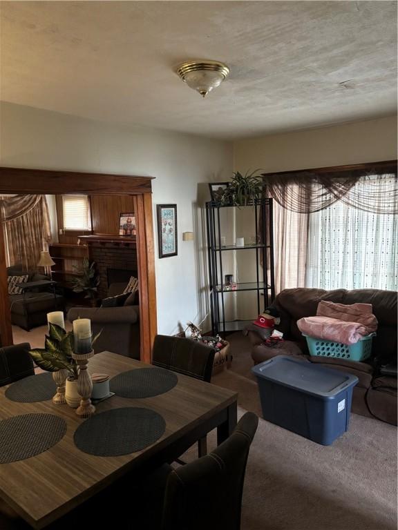 115 Woodrow Ct, Sharon, PA 16146 - carpeted dining area featuring a fireplace