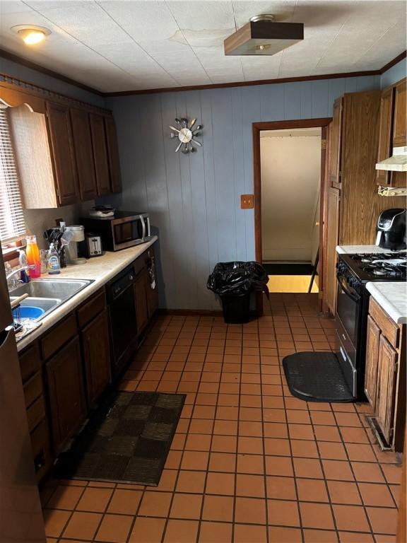 115 Woodrow Ct, Sharon, PA 16146 - kitchen with light countertops, under cabinet range hood, a sink, light tile patterned floors, and black appliances