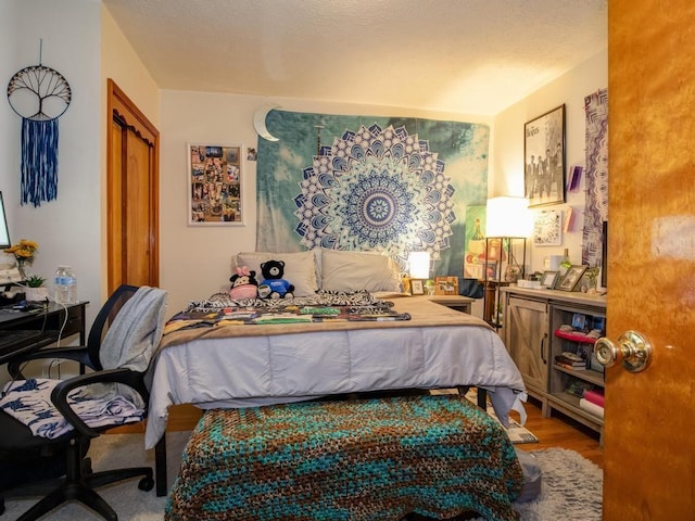 bedroom featuring wood finished floors