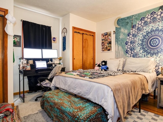 bedroom featuring a closet and baseboards