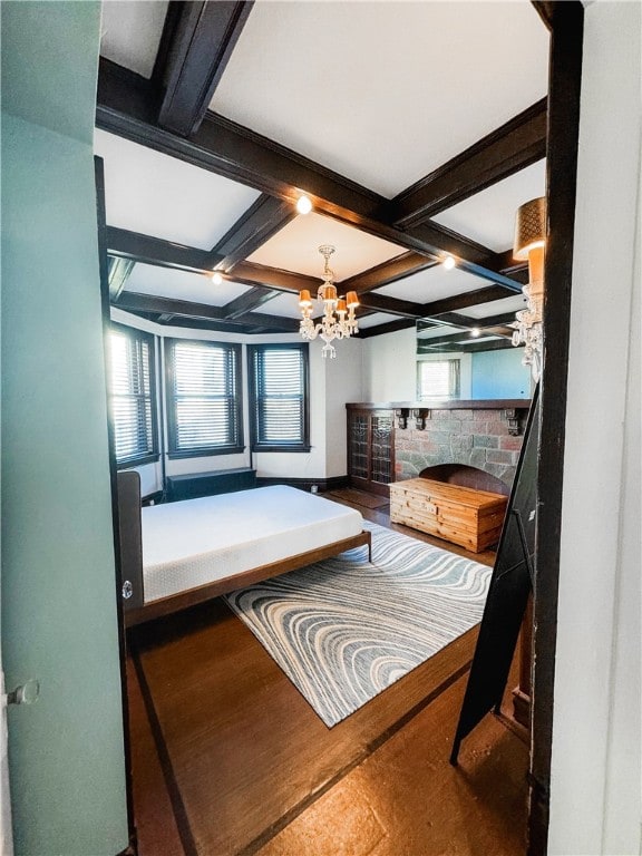 918 California Ave, Avalon, PA 15202 - bedroom with an inviting chandelier, a fireplace, coffered ceiling, and beam ceiling