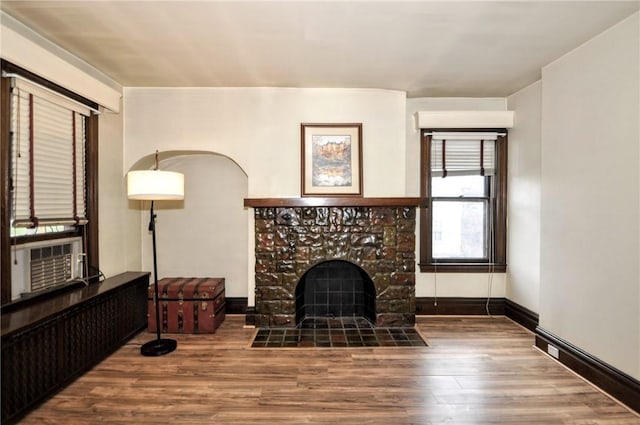 918 California Ave, Avalon, PA 15202 - unfurnished living room featuring a tiled fireplace, baseboards, wood finished floors, and cooling unit