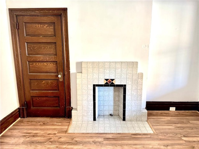 918 California Ave, Avalon, PA 15202 - interior details with baseboards, wood finished floors, and a tile fireplace