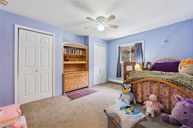 410 Main St, Dawson, PA 15428 - bedroom featuring a baseboard radiator, ceiling fan, two closets, and light carpet