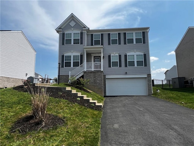 view of front of property featuring fence, an attached garage, brick siding, stairway, and driveway