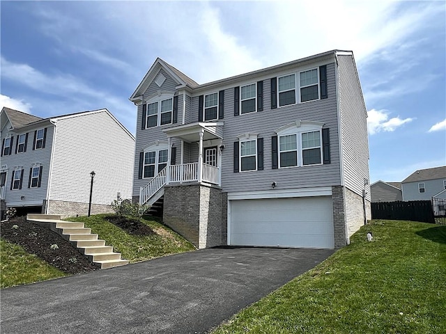 view of front facade featuring fence, a garage, stairway, a front yard, and driveway