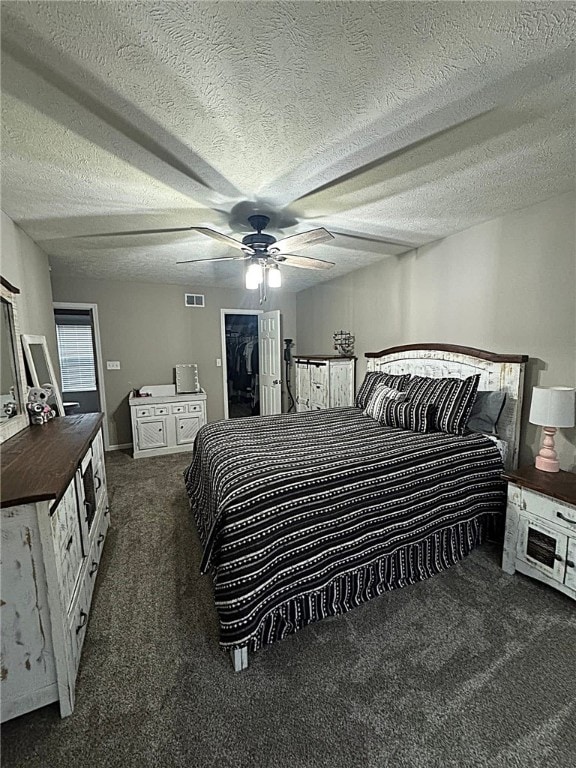 bedroom featuring carpet, a ceiling fan, and visible vents