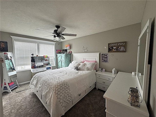 bedroom with dark carpet, a textured ceiling, and ceiling fan