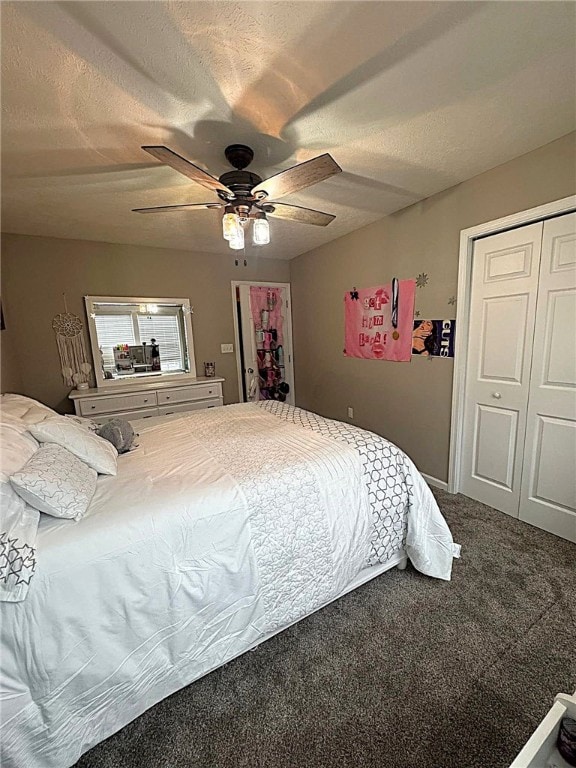 bedroom with ceiling fan, carpet, a closet, and a textured ceiling