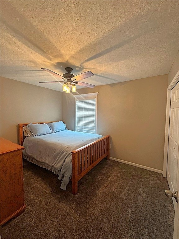 bedroom featuring carpet floors, a ceiling fan, and a textured ceiling