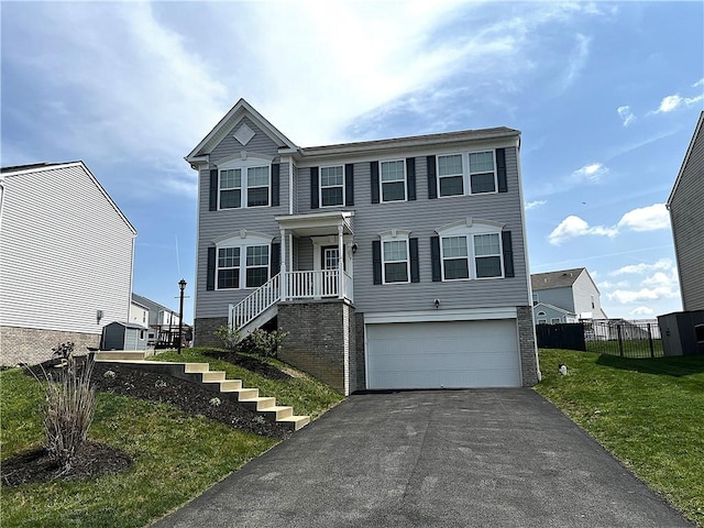 view of front of home featuring fence, stairs, a garage, a front yard, and driveway