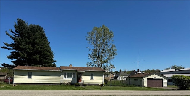 view of front facade featuring a front lawn and a chimney