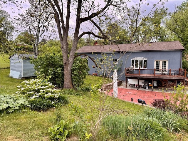 190 Orchard Ln, Economy, PA 15042 - rear view of house featuring a deck, a patio area, a storage shed, a shingled roof, and french doors