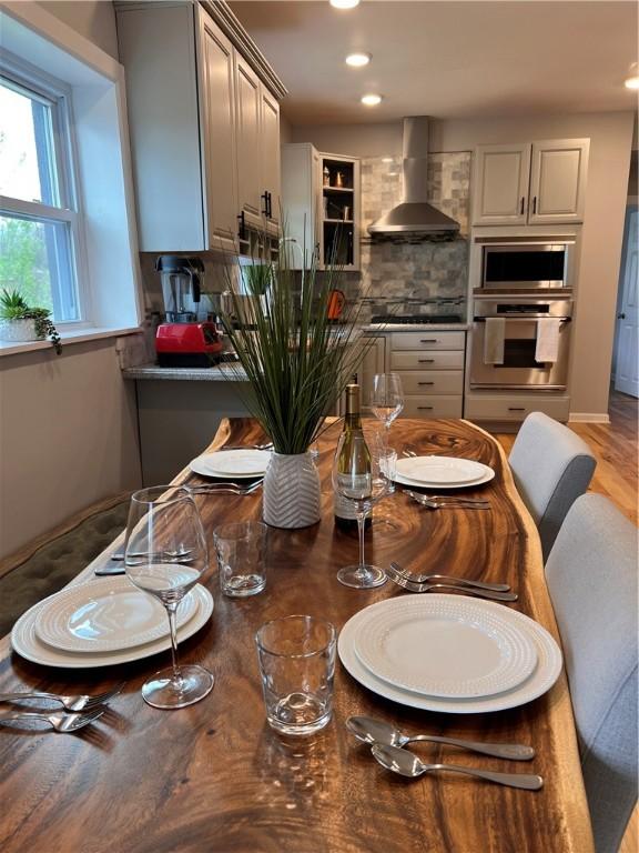 dining room featuring recessed lighting and light wood-type flooring