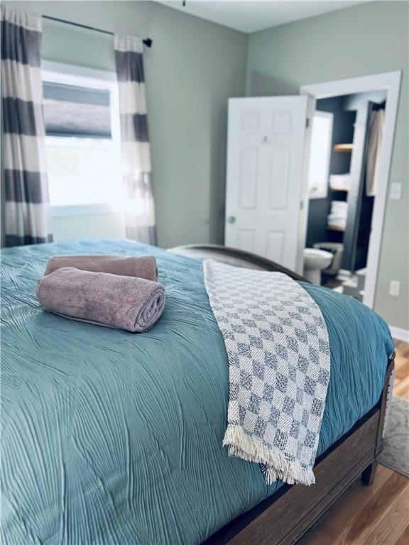 bedroom with wood finished floors