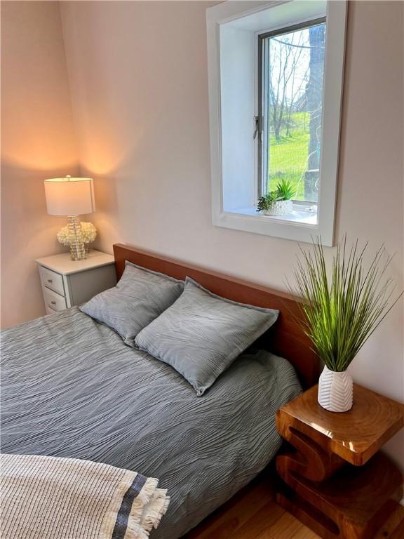 bedroom with wood finished floors