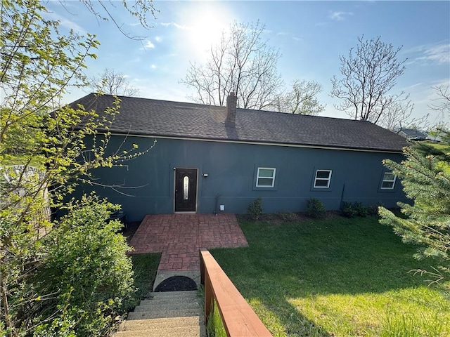 190 Orchard Ln, Economy, PA 15042 - back of house featuring roof with shingles, a yard, a chimney, and stucco siding