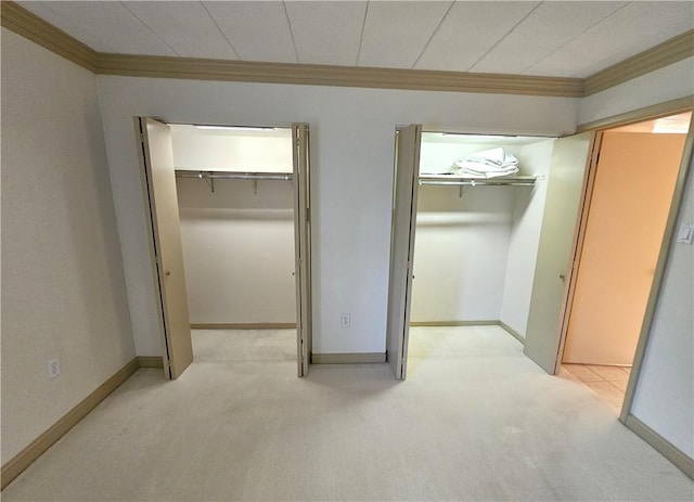 820 E Beau St Unit 2J, South Strabane, PA 15301 - unfurnished bedroom featuring a spacious closet, ornamental molding, baseboards, and light colored carpet