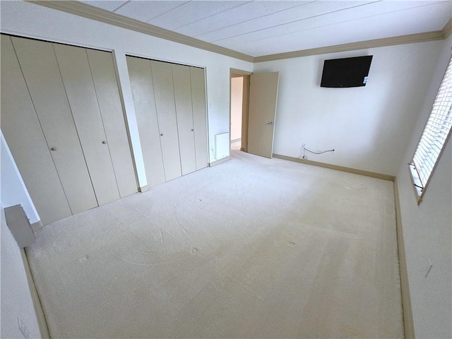 820 E Beau St Unit 2J, South Strabane, PA 15301 - unfurnished bedroom featuring carpet floors, ornamental molding, multiple closets, and baseboards