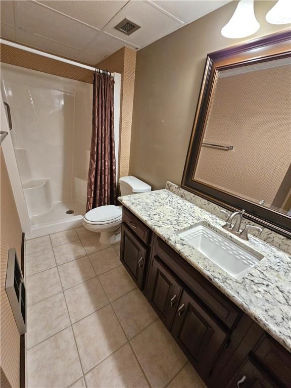 820 E Beau St Unit 2J, South Strabane, PA 15301 - bathroom with tile patterned flooring, vanity, toilet, a shower with shower curtain, and visible vents