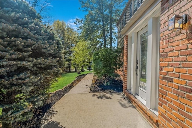 1202 Oakridge Rd, South Fayette, PA 15057 - view of property exterior featuring brick siding and a patio