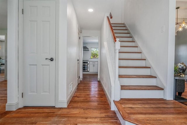 1202 Oakridge Rd, South Fayette, PA 15057 - staircase with wood finished floors, recessed lighting, and baseboards