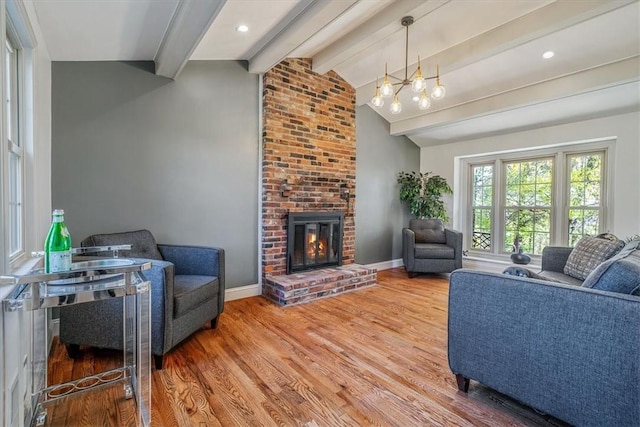 1202 Oakridge Rd, South Fayette, PA 15057 - living area with wood finished floors, a fireplace, and baseboards